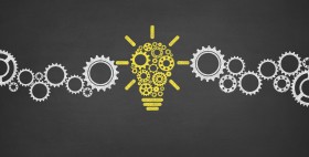 Idea with Gears Concept on Blackboard